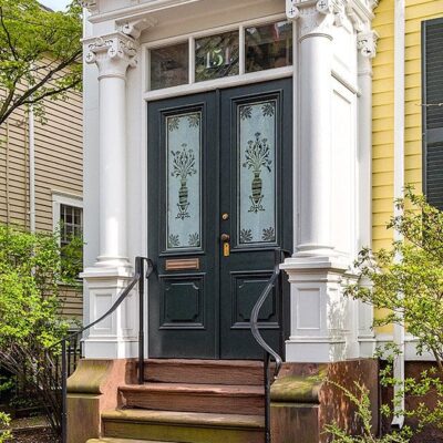 A house with a front door and steps.